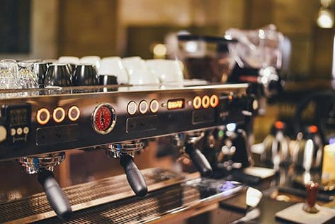 Commercial espresso machine in a coffee shop.