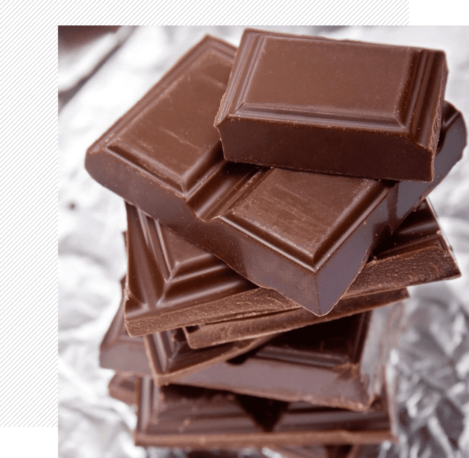 Pile of glossy chocolate squares on foil